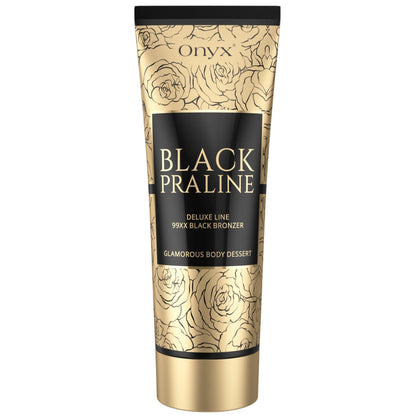 Produktaufnahme der Onyx Black Praline Bräunungscreme in goldener Tube mit floraler Verzierung auf hellem Hintergrund
